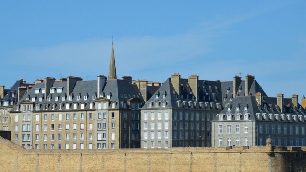 Beautiful traditional buildings under a clear sky in Saint-Malo, Bretagne, France.
