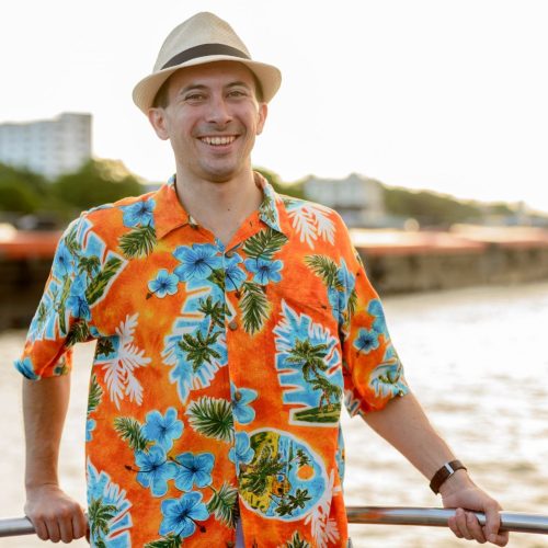 happy young handsome tourist man at pier against v 6hgmvej.jpg